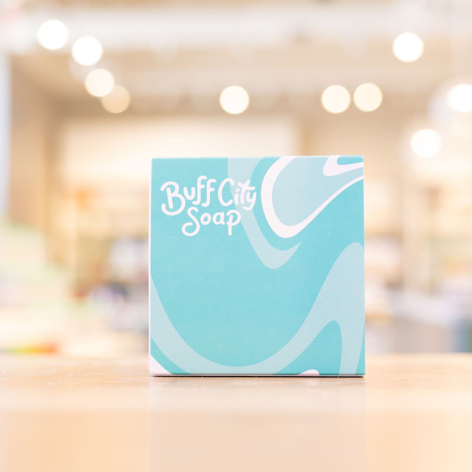 Buff City Soap Gift Set with blue and white packaging on counter