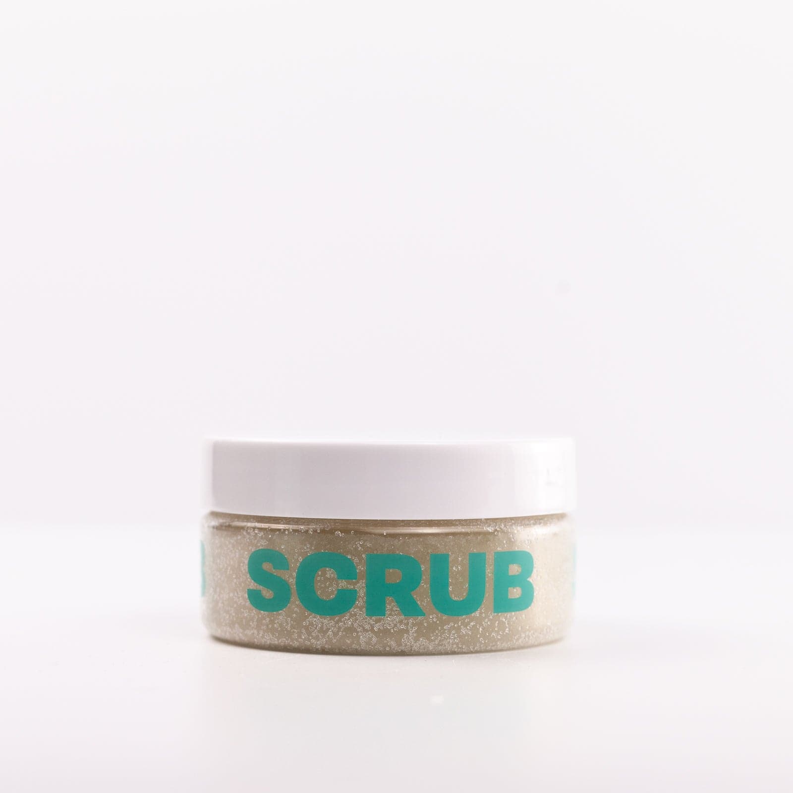 Clear Body Scrub container with teal lettering and white lid against white background