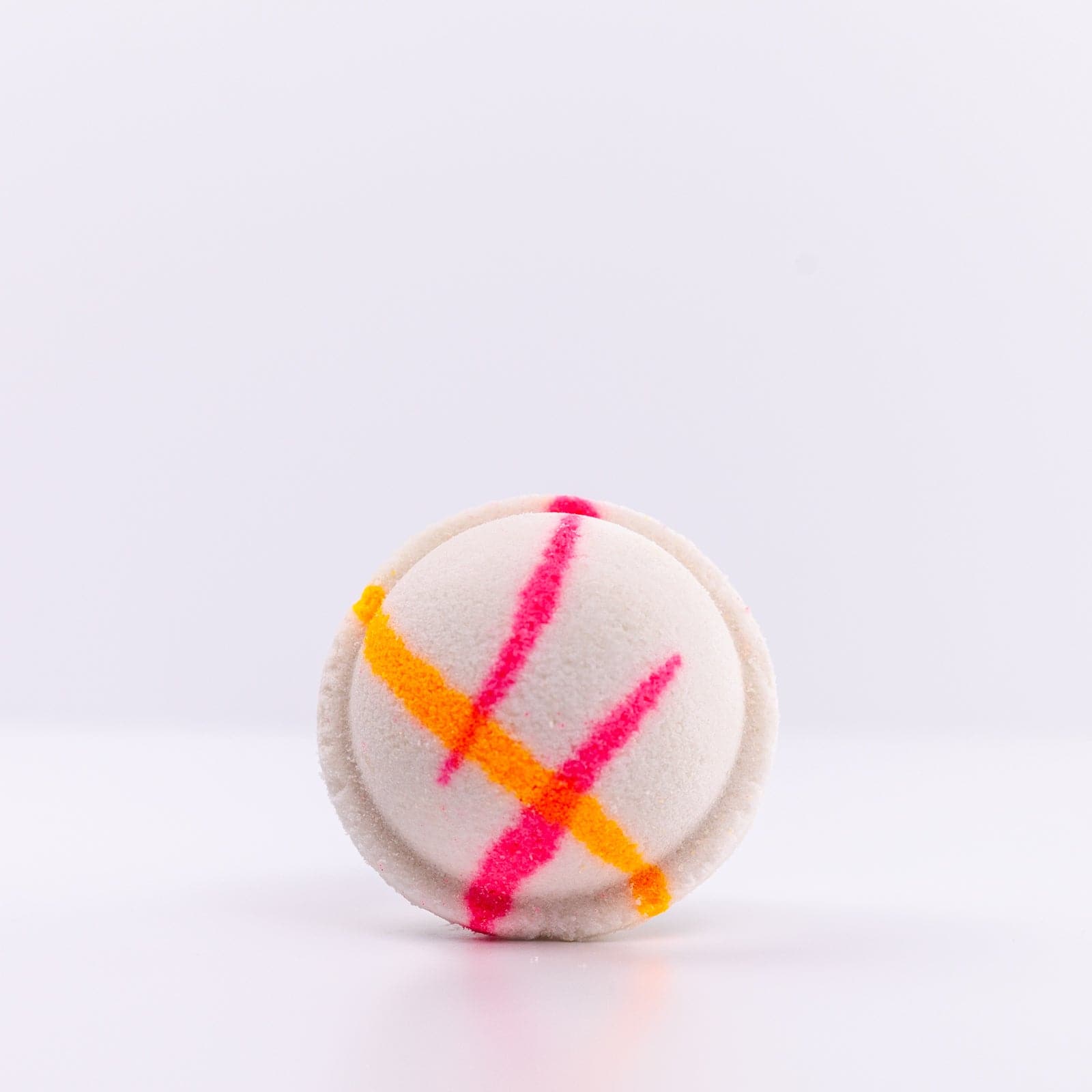 Island Nectar Bath Bomb with pink and orange design against white background