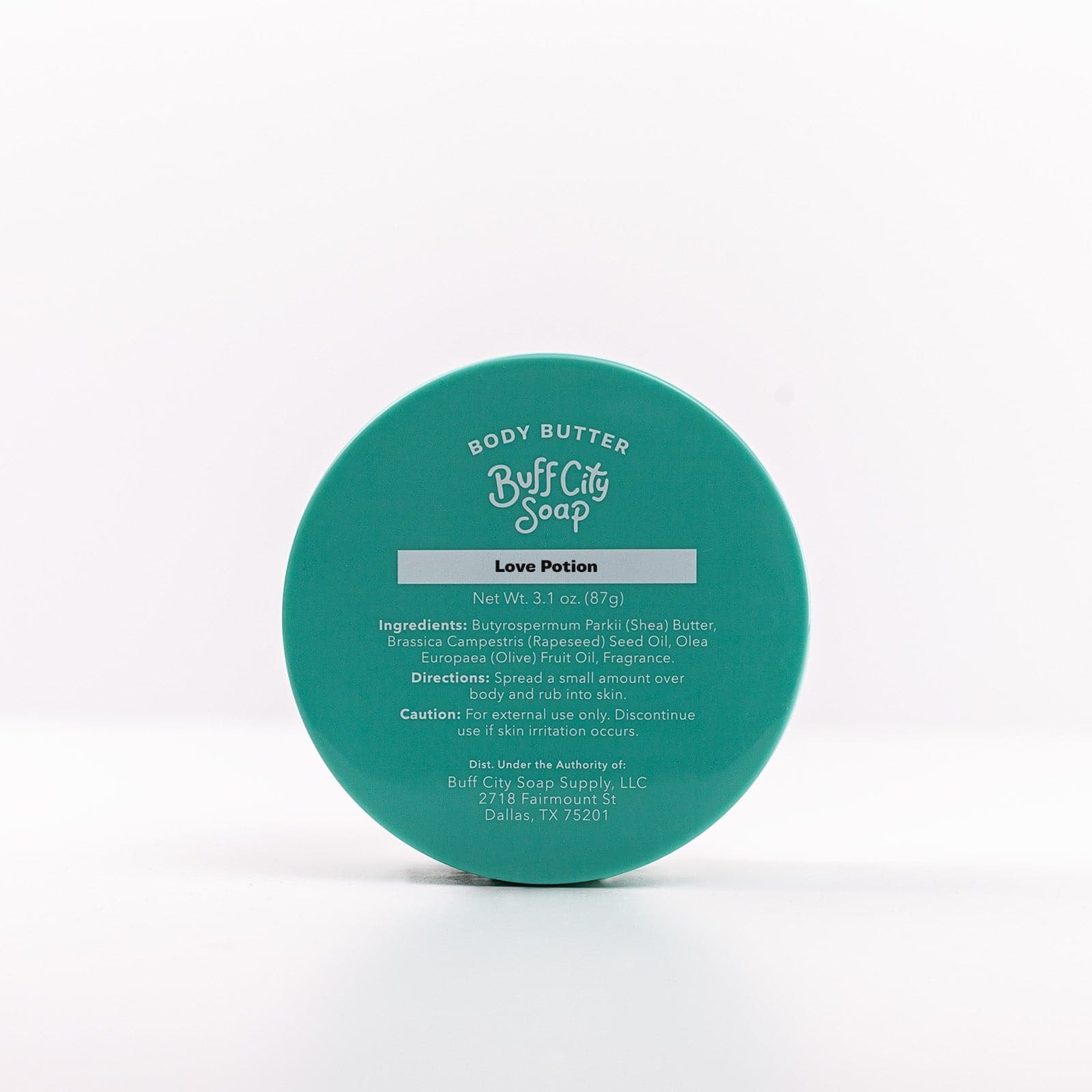 Buff City Soap's love potion body butter lid with directions, ingredients, and caution listed on it