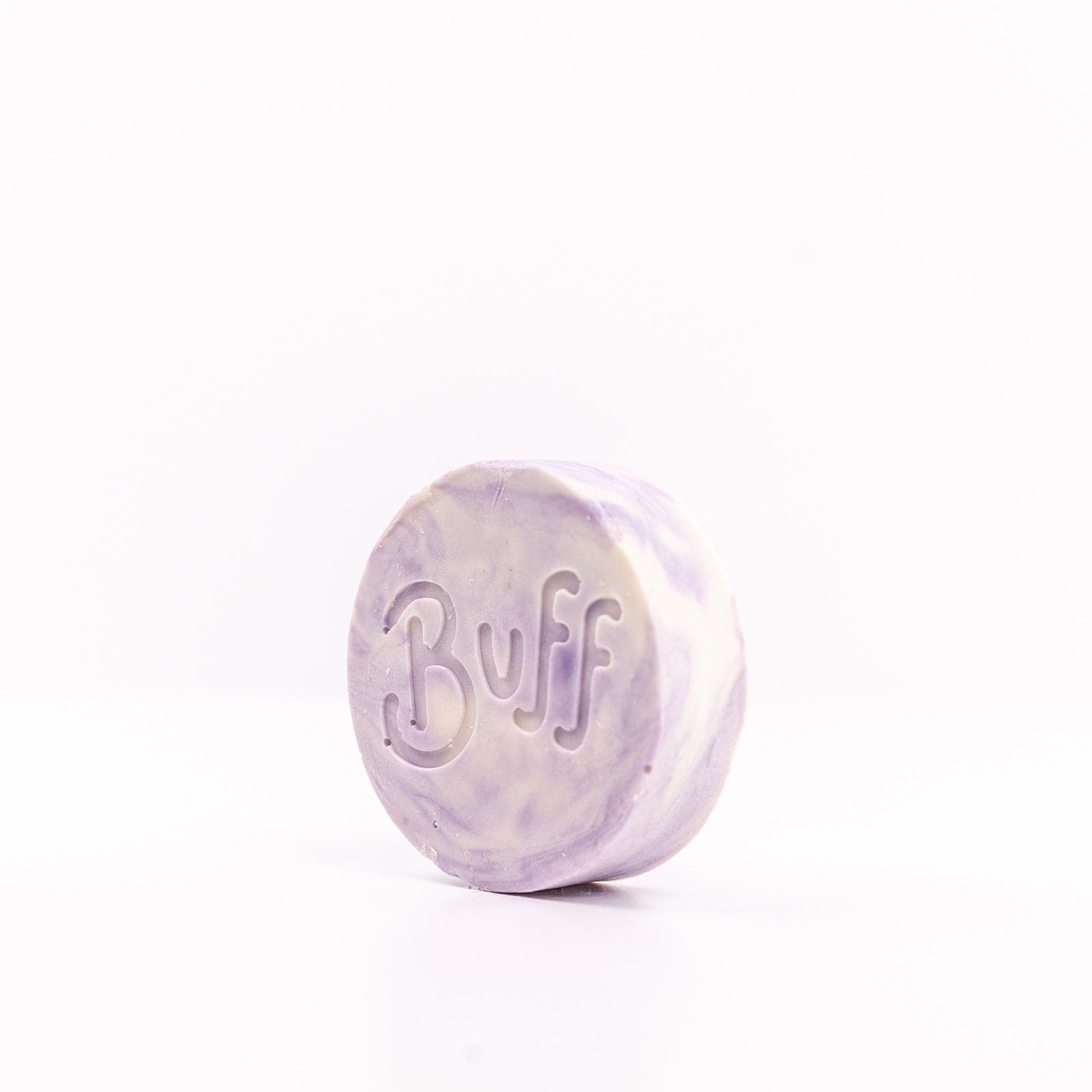 Buff City Soap's love potion multi-colored shave bar with a buff inscription
