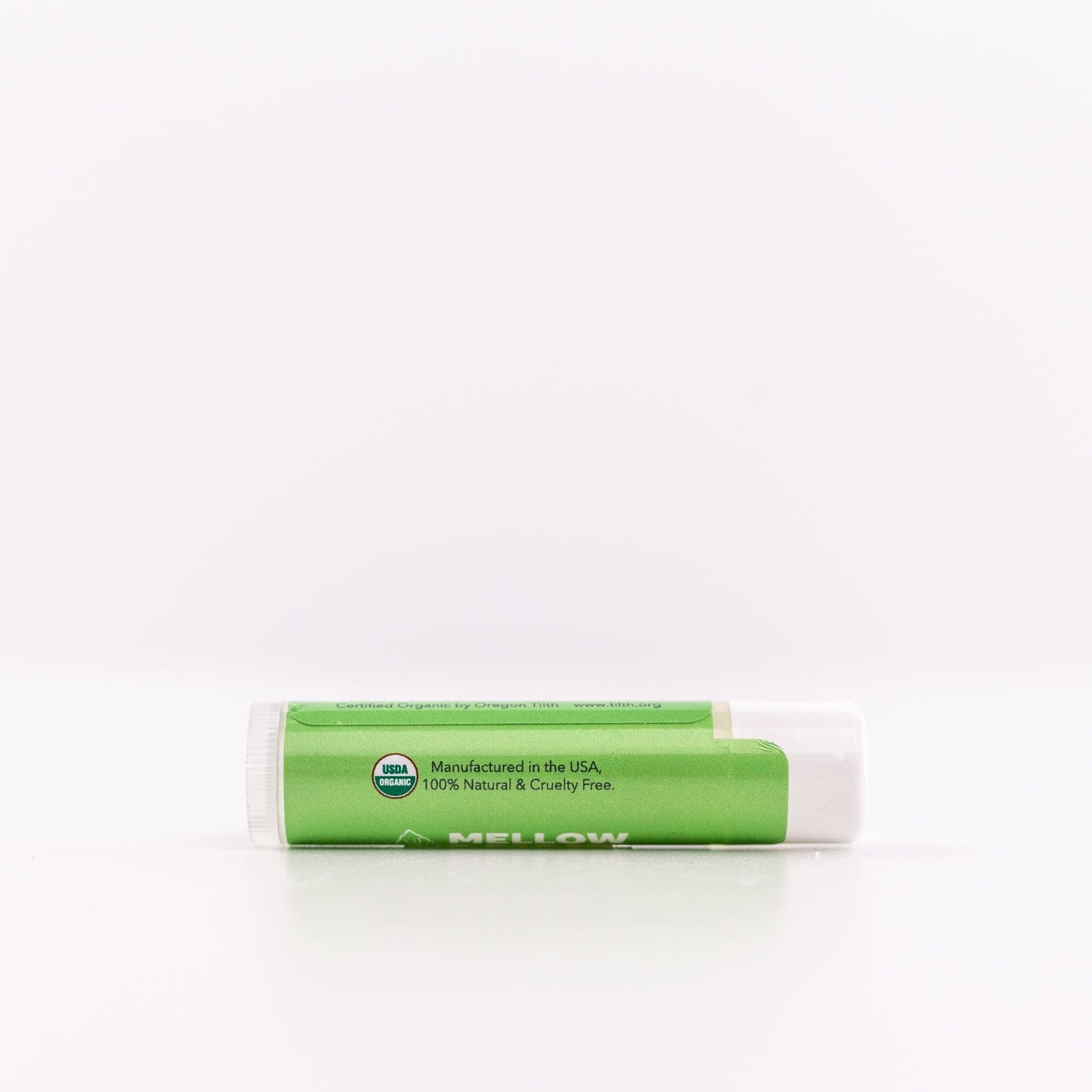 Green Mellow Mint Lip Balm container against white background 