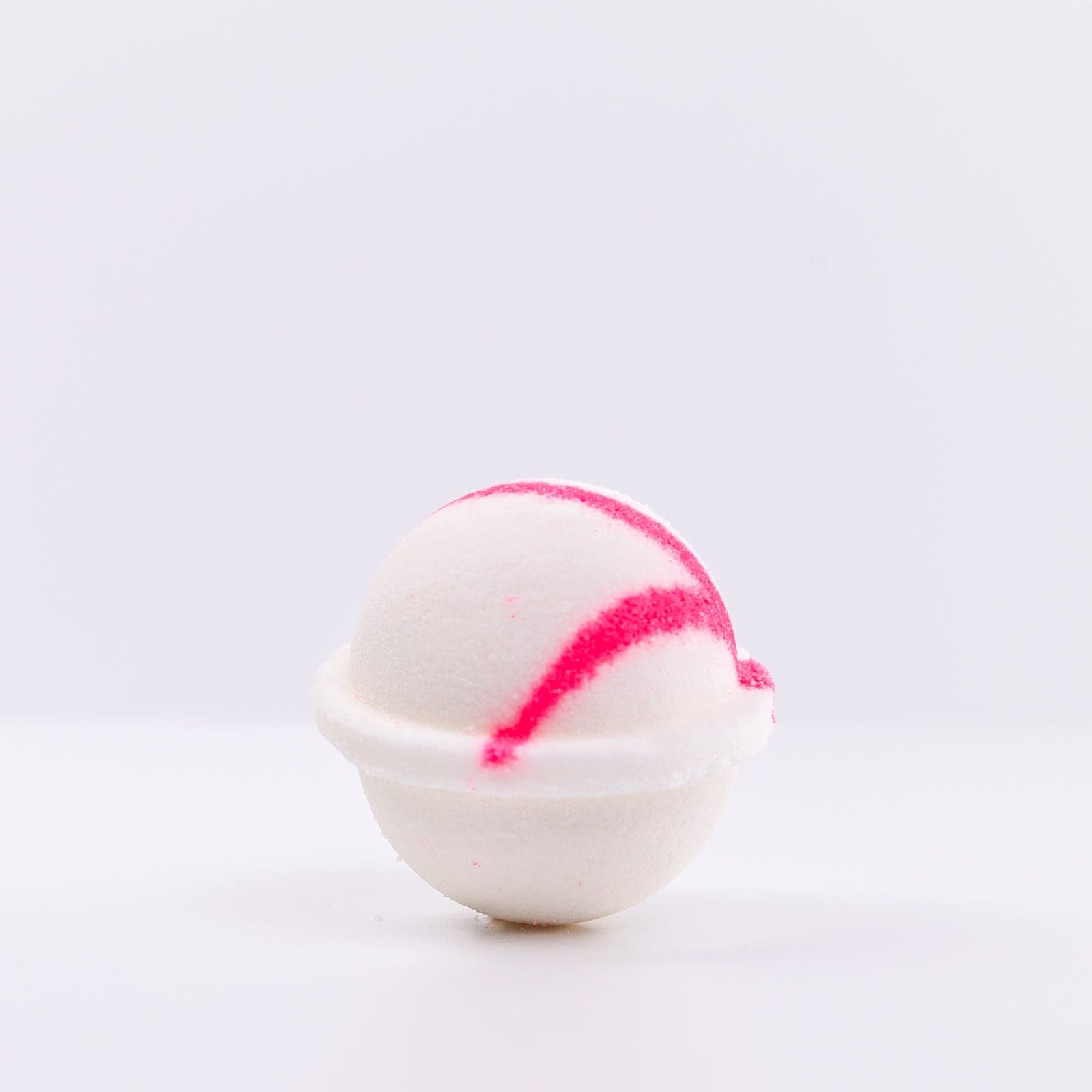one white Mermaid Bath Bomb with pink "X" design on right side of bath bomb